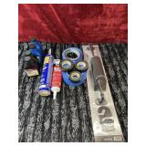 Bundle of engine oil, electrical tape and more.