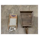 Rustic wooden wheelbarrow planter and washboard.