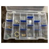 Fashionable costume jewelry in storage box