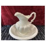 Vintage white ceramic pitcher and wash basin.