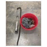 2 pry bars and bowl full of chains.
