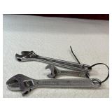 Companion adjustable wrenches.