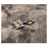 .925 sterling silver earrings feature a oval