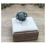Marked sterling silver ring features a