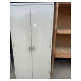 Metal storage cabinet appears to be a used HON