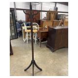 Antique brown wooden coat tree features a sturdy