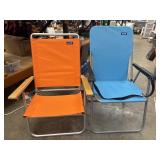 2 Blue Water Beach folding chairs, one blue one