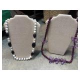Purple beaded necklace features prominent