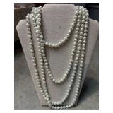 Long, white faux pearl strand, vintage