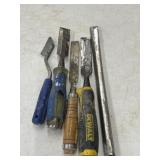 Bundle of used woodworking chisels.