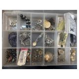 Jewelry makerï¿½s container filled with jewelry