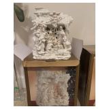 Dillards lighted stable with nativity figurine.