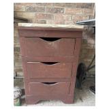 Vintage wooden three-drawer chest features a
