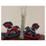 Long, clear glass trumpet vase filled with