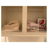 Vintage lace and crochet-trimmed towels alongside