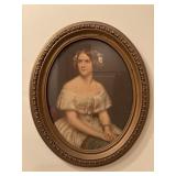 Framed vintage oval wall art piece depicts the