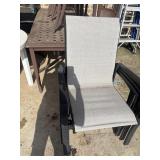 Stackable outdoor patio dining armchairs.