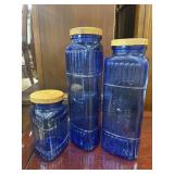 3 Cobalt blue glass canisters.