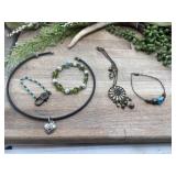 Assortment of artisanal jewelry pieces, including