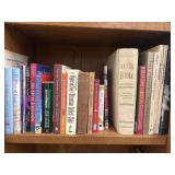 Bundle of books, including a large Holy Bible,