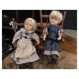 Pair of vintage porcelain elderly dolls dressed