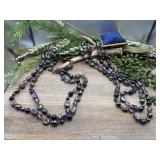Multi-strand necklace features iridescent peacock