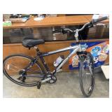 Blue and silver Trek 7100 Multitrack Hybrid Bike.