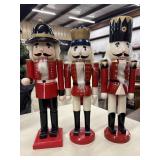 Three traditional wooden nutcracker soldier