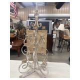 Distressed, white-painted metal scrollwork