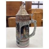 Vintage ceramic beer stein with a hinged pewter