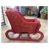 Red-painted, handmade wooden decorative sleigh