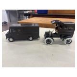 2 UPS delivery truck die-cast coin bank models.