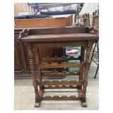 Freestanding wooden wine rack with a top serving