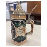 Vintage ceramic German beer stein featuring a