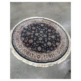 Round Persian-style floral area rug.