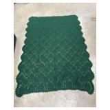 Handmade dark green crochet blanket with a