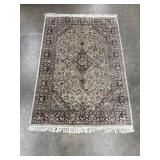 Authentic, hand-knotted oriental area rug.