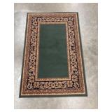 Traditional rectangular area rug.