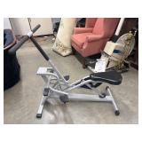 A squat-assist and rowing exercise machine.