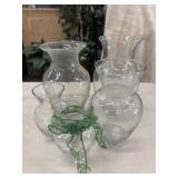 5 Clear glass vases of varying sizes with bulbous