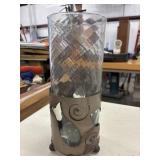 Decorative glass hurricane candle holder with a
