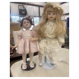 2 Vintage-style decorative porcelain dolls.