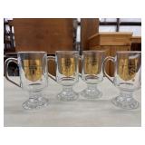 Clear glass footed Irish coffee mugs featuring a