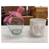 Clear glass vase with a rounded body and a pink