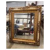Large, ornate rectangular wall mirror with a