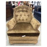 Button-tufted velvet armchair upholstered in a
