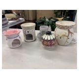 Collection of ceramic wax warmers, prominently