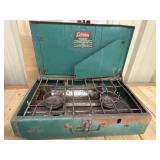 Coleman Model 413G two-burner camp stove, which