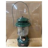 Vintage green Coleman two-mantle liquid fuel