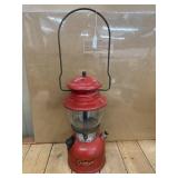 Vintage red Coleman Model 200A single-mantle gas